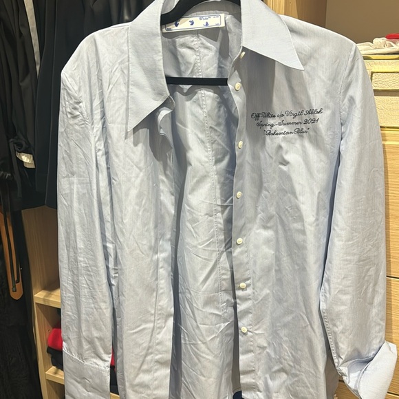 Off-white pin stripe button down women’s  with quote on shirt. New with tags.